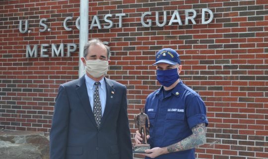 Navy League Memphis Council President Buz Sorce presents Marine Science Technician 2nd Class Michael A. Roberts with his Enlisted Person of the Year award for the Sector Lower Mississippi River.